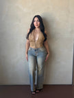 Front view of model wearing Tan Suede Lace-Up Corset Halter Top