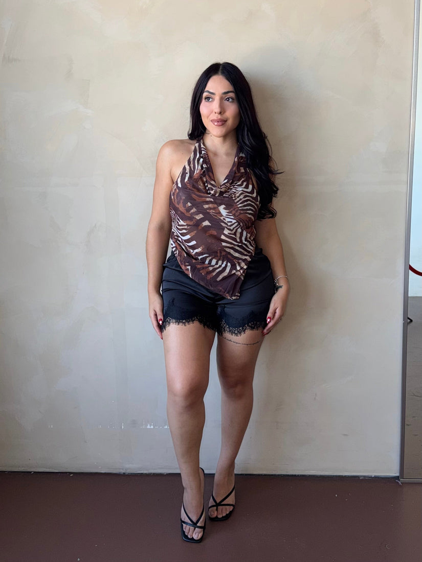 Front view of model wearing Zebra Print Cowl Neck Halter Top