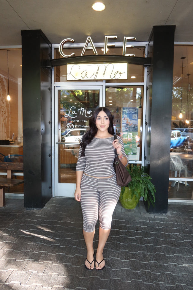 Back view of a model wearing a stretchy micro-ribbed capri set