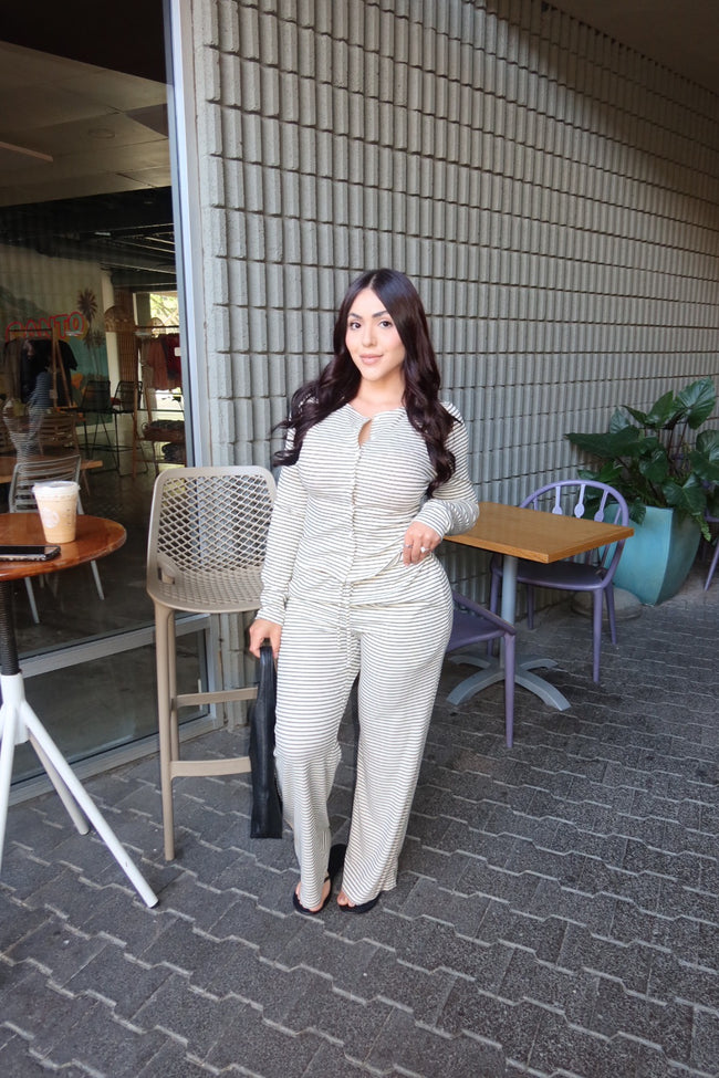 Model wearing a stretchy long-sleeve top and matching full-length pants