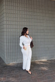 Front view of a white long-sleeve zip-front two-piece set