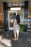 Model wearing a stretchy micro-ribbed matching capri set